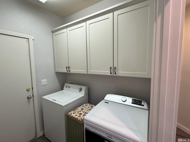 washroom with cabinets and independent washer and dryer