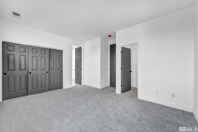 unfurnished bedroom featuring carpet flooring