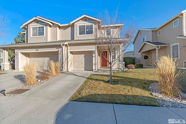 view of front of home featuring a front yard and a garage