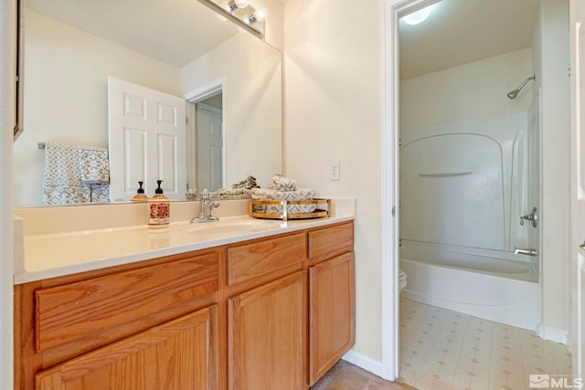 full bathroom featuring bathing tub / shower combination, vanity, and toilet