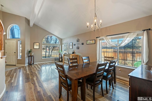 dining area with wood-type flooring, vaulted ceiling with beams, and an inviting chandelier