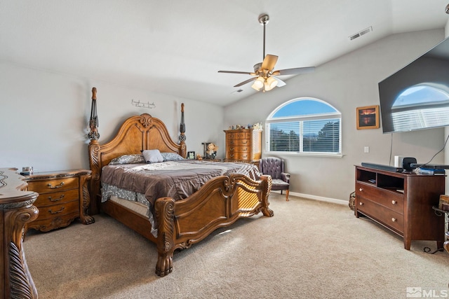 carpeted bedroom with multiple windows, ceiling fan, and lofted ceiling