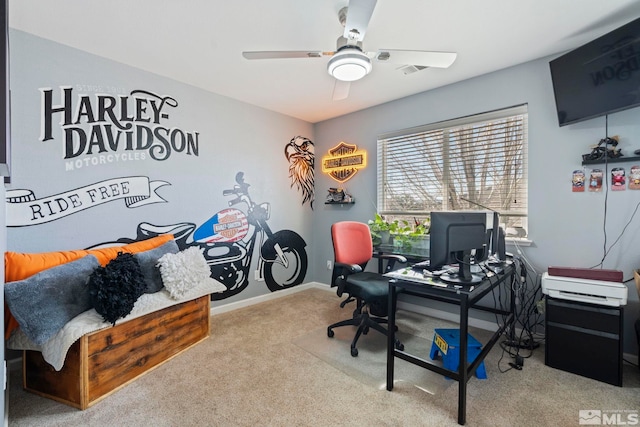 carpeted office space with ceiling fan