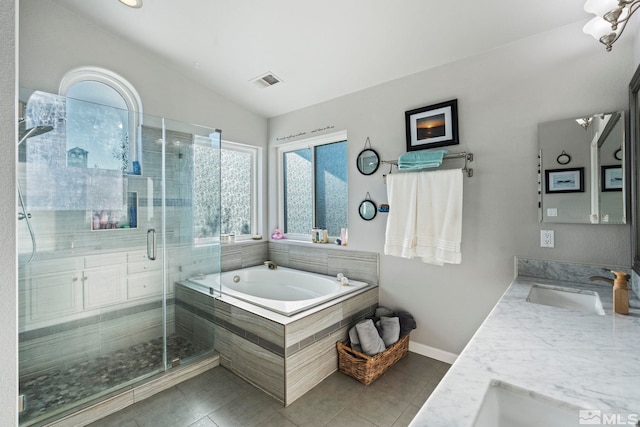 bathroom featuring tile patterned flooring, vanity, lofted ceiling, and independent shower and bath