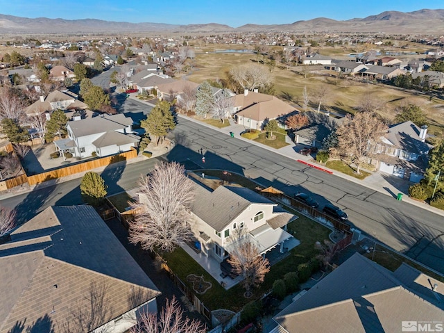 birds eye view of property featuring a mountain view