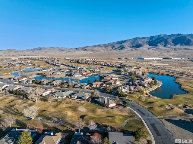 bird's eye view with a water and mountain view