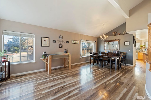 dining area with hardwood / wood-style floors, high vaulted ceiling, beamed ceiling, and a notable chandelier