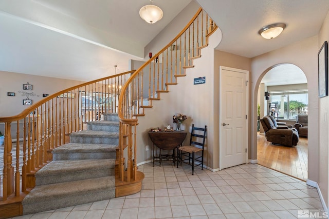 stairway with hardwood / wood-style floors