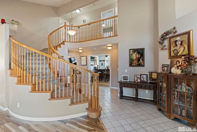 interior space featuring hardwood / wood-style floors and a towering ceiling