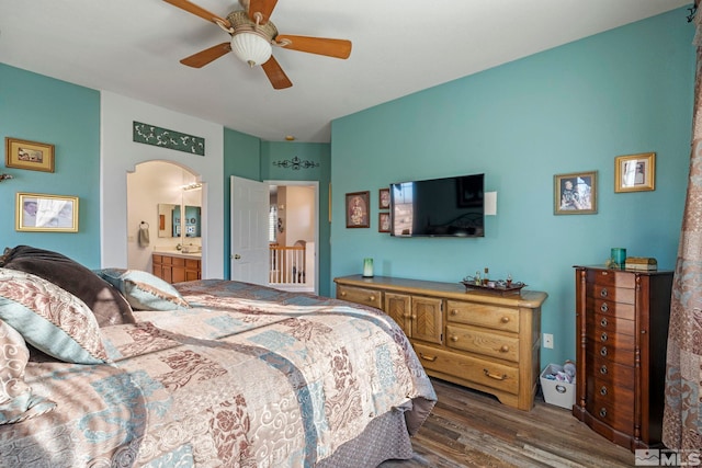 bedroom featuring ensuite bathroom, ceiling fan, and dark hardwood / wood-style floors