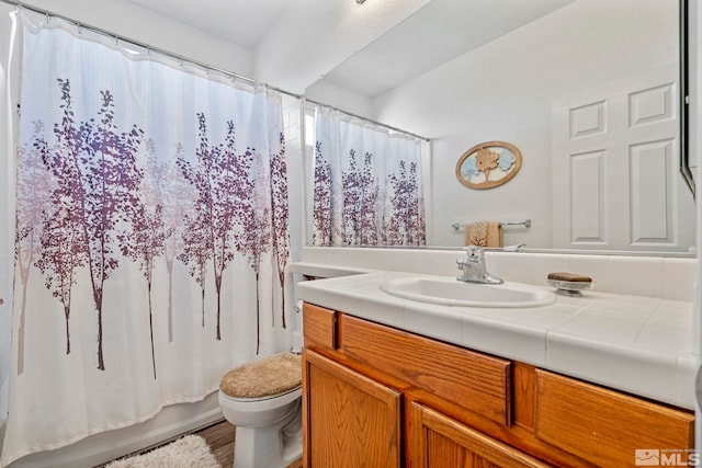 full bathroom with shower / bathtub combination with curtain, vanity, toilet, and wood-type flooring