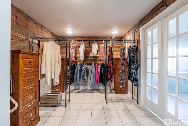 spacious closet with light tile patterned flooring