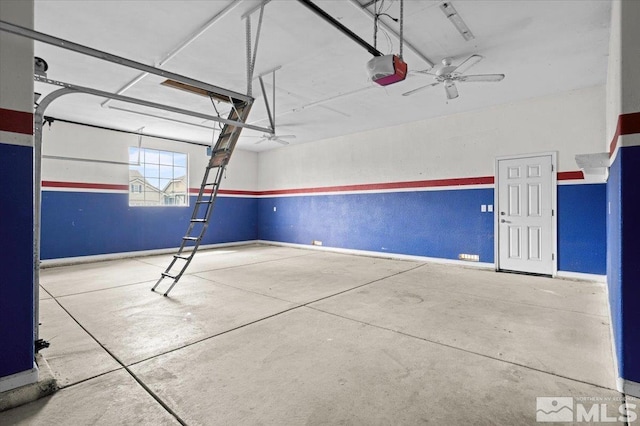 garage with baseboards and a garage door opener