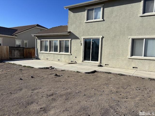 rear view of property featuring a patio