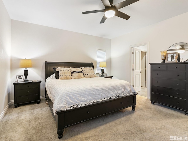 bedroom featuring ceiling fan and light carpet