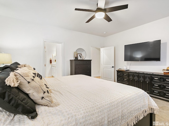 bedroom featuring carpet flooring, ceiling fan, and ensuite bath