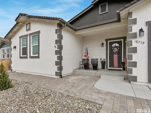 entrance to property with covered porch