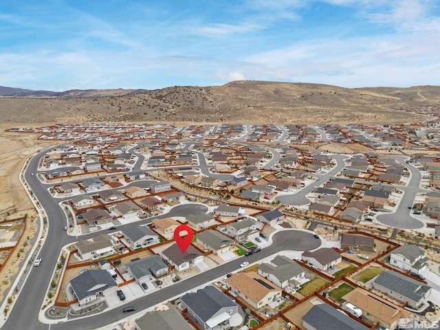 birds eye view of property featuring a mountain view