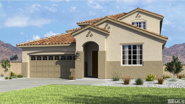 mediterranean / spanish-style house with a mountain view, a front yard, and a garage