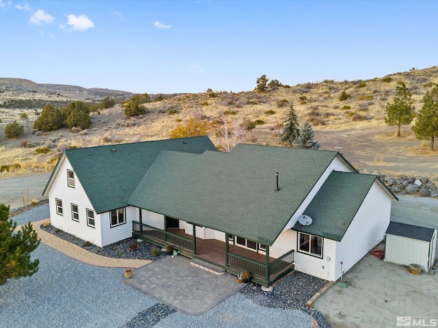 birds eye view of property with a mountain view