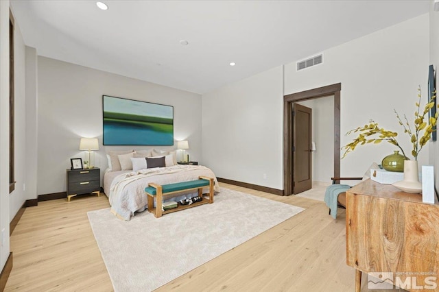 bedroom with light hardwood / wood-style flooring