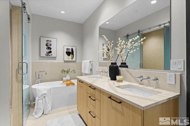 bathroom with separate shower and tub, tile patterned floors, and vanity