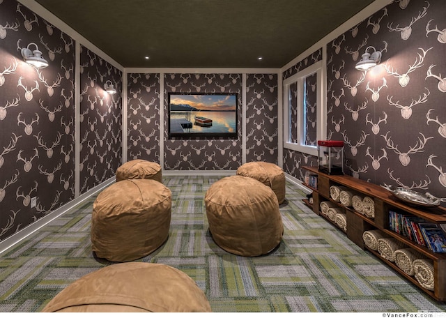 carpeted home theater with ornamental molding