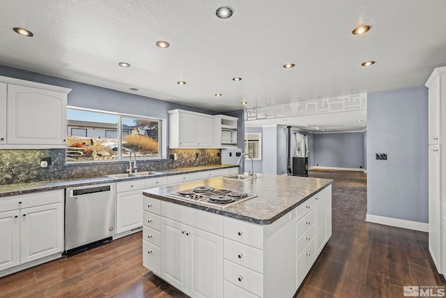 kitchen featuring white cabinetry, sink, and appliances with stainless steel finishes