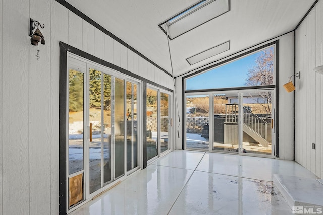 unfurnished sunroom with vaulted ceiling