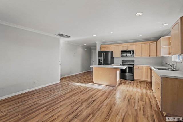 kitchen with a center island, light brown cabinets, black appliances, sink, and light hardwood / wood-style flooring