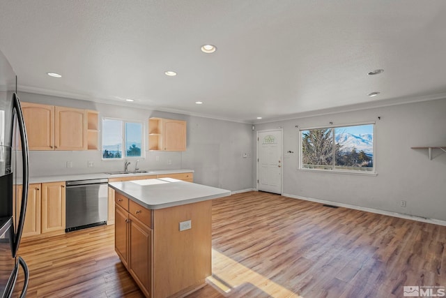 kitchen featuring a kitchen island, light wood-type flooring, stainless steel appliances, and light brown cabinets