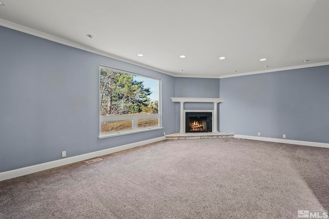 unfurnished living room with carpet flooring and ornamental molding