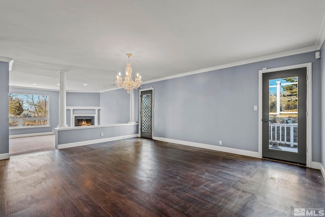 unfurnished living room featuring plenty of natural light, dark hardwood / wood-style flooring, and crown molding