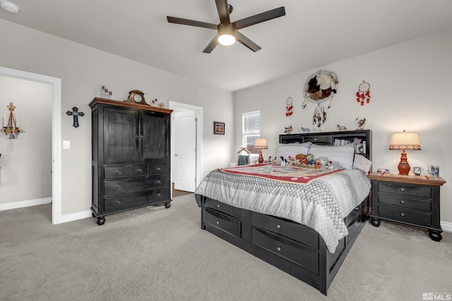 bedroom with ceiling fan and light colored carpet