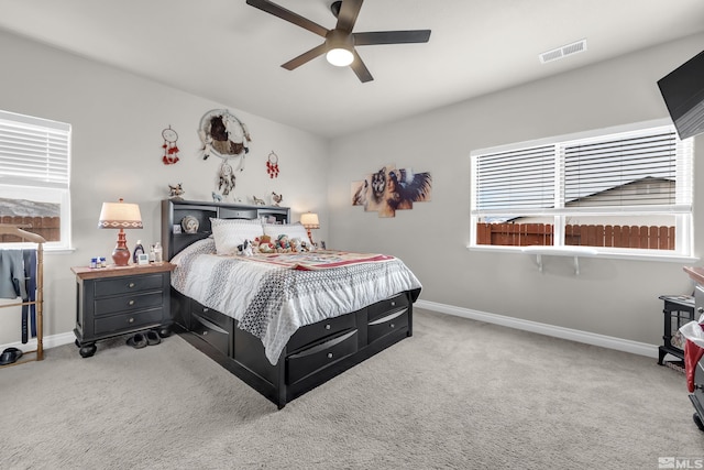 carpeted bedroom featuring ceiling fan