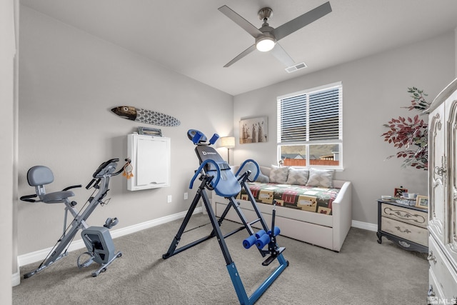 exercise room featuring ceiling fan and light carpet