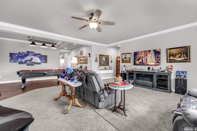 living room featuring ceiling fan, wood-type flooring, and ornamental molding