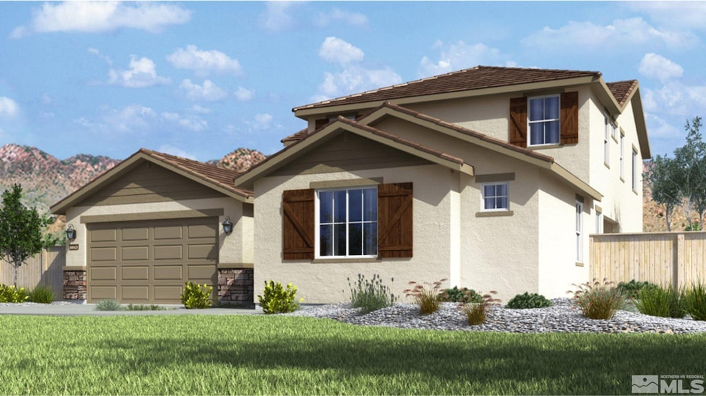 view of front of home featuring a garage and a front yard