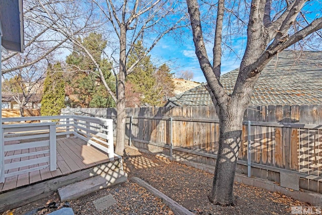 view of yard with a wooden deck