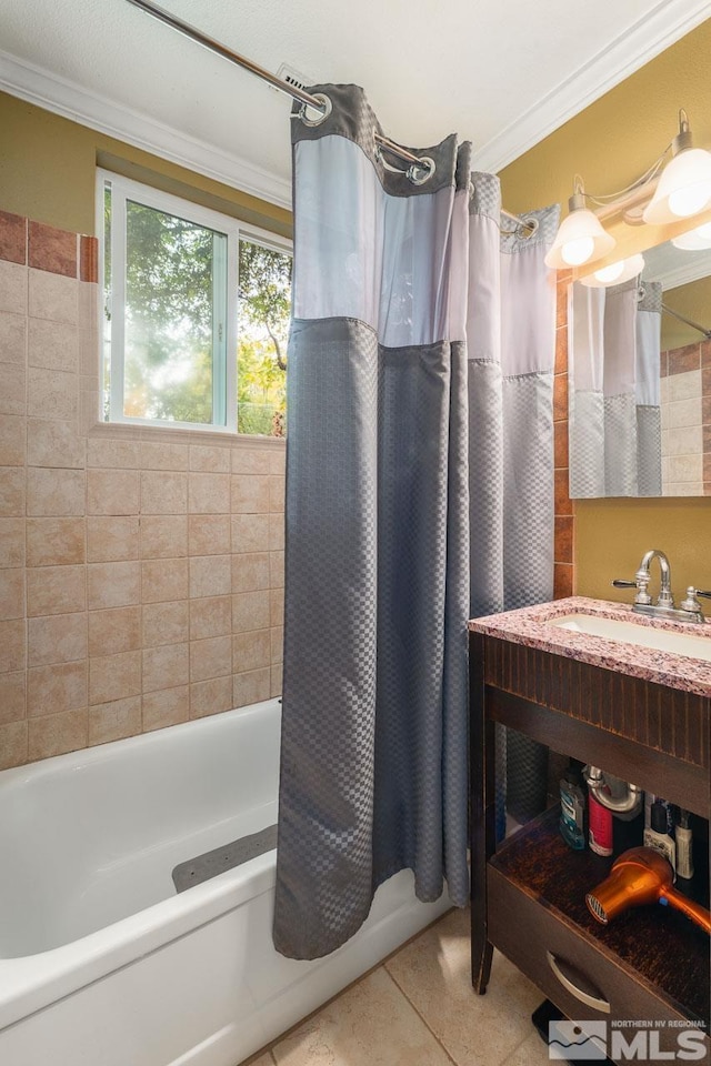 bathroom with crown molding, tile patterned flooring, shower / bathtub combination with curtain, and sink