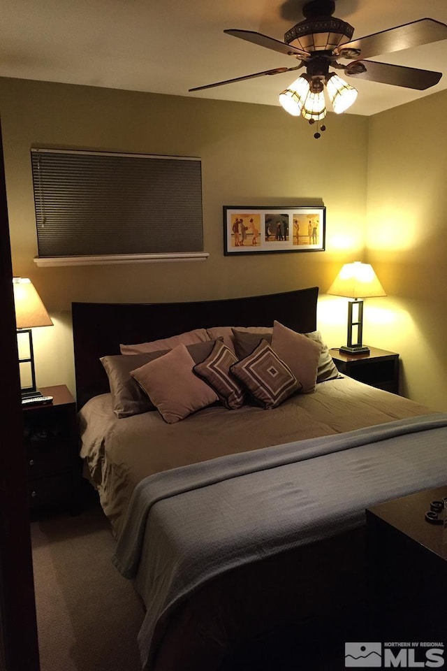 carpeted bedroom with ceiling fan