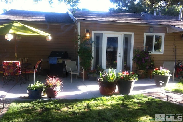 rear view of house featuring a patio