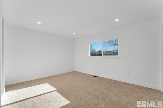 spare room featuring carpet flooring