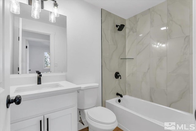 full bathroom with tiled shower / bath combo, toilet, and vanity