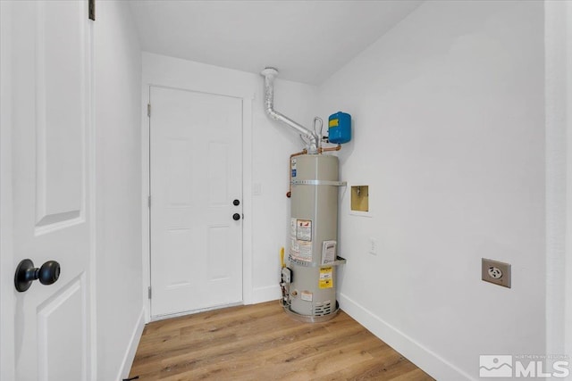 utility room featuring water heater