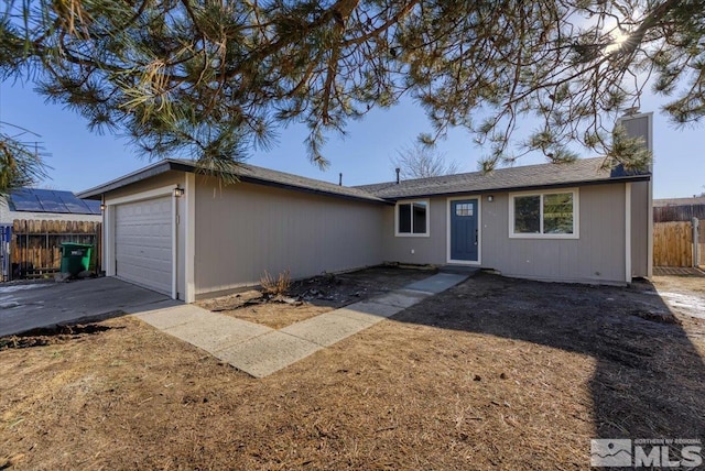 ranch-style home featuring a garage