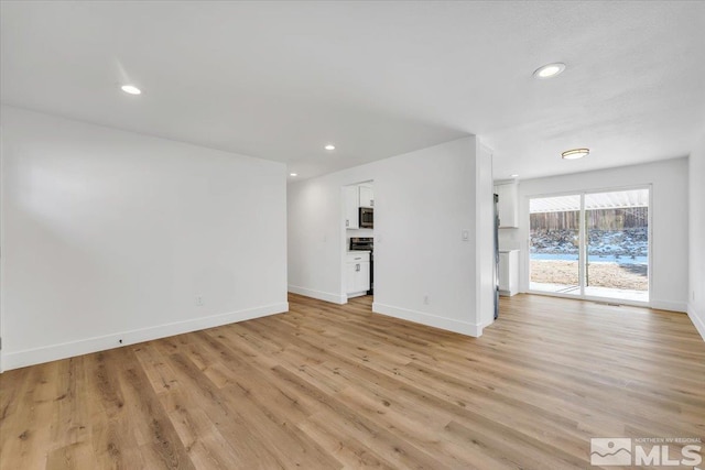 unfurnished living room featuring light hardwood / wood-style flooring