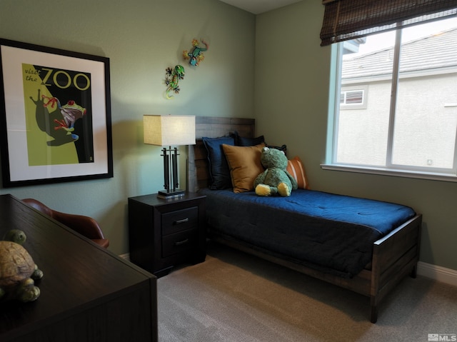 bedroom featuring carpet floors and multiple windows