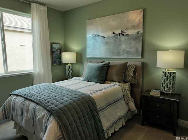 carpeted bedroom featuring multiple windows