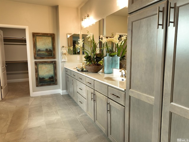 bathroom with tile patterned floors and vanity